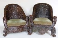 Lot 240 - Two Burmese carved hardwood chairs.