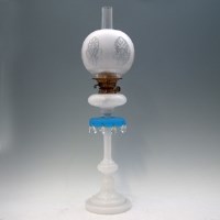 Lot 84 - Oil lamp with turned glass base and droplet decoration.
