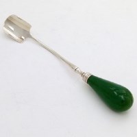 Lot 217 - George III silver cheese scoop with green ivory handle.