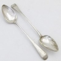 Lot 222 - Two George III silver gravy spoons.