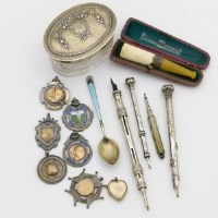 Lot 231 - Collection of medals, a spoon, propelling pencils and an oval box.