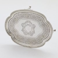 Lot 240 - George III silver teapot stand.