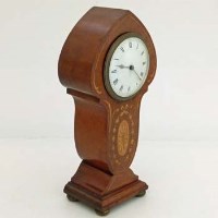 Lot 5 - Edwardian mahogany art nouveau mantel clock.