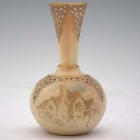 Lot 199 - Early 20th Century Graingers Worcester reticulated vase with a raised gilt house under a pierced body and neck.