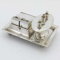 Lot 257 - Silver table top cigar cutter and lighter.