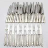 Lot 264 - Eight pairs of silver bladed fish knives and forks, and twelve pairs of silver handled knives with stainless blades.