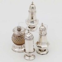 Lot 283 - Silver pepper mill and three casters.