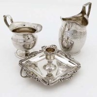 Lot 307 - George III silver cream helmet; Chester cream jug; chamber stick (3).