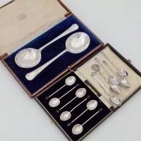 Lot 318 - Cased pair of serving spoons; cased silver bean coffee spoons; five odd silver spoons.