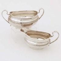 Lot 324 - Silver cream jug and a sugar bowl.