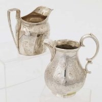 Lot 326 - Two silver creamers.