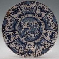 Lot 127 - Blue and white Delft charger, peacock decoration.