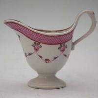 Lot 134 - New Hall clip-handle jug, floral swags (pattern