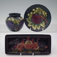 Lot 176 - Moorcroft birds pecking fruit pattern vase