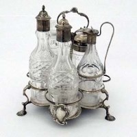 Lot 204 - Silver Warwick cruet stand and matched bottles