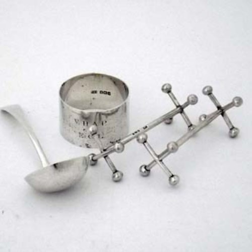 Lot 214 - Pair of silver knife rests; napkin ring; small