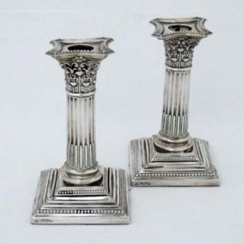 Lot 216 - Pair filled silver Corinthian candlesticks