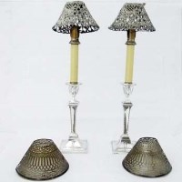 Lot 240 - Pair filled silver candlesticks with E.P. shades.