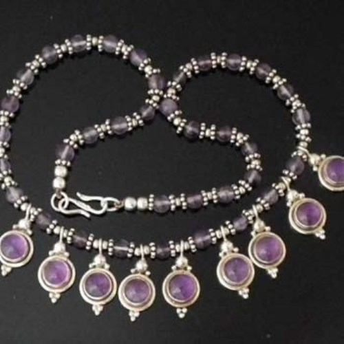 Lot 283 - Amethyst and silver fringe necklace of nine