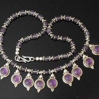 Lot 283 - Amethyst and silver fringe necklace of nine