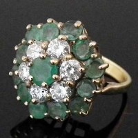 Lot 292 - 18ct gold emerald and diamond tiered cluster