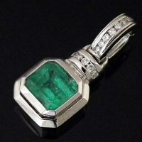 Lot 294 - Emerald and diamond pendant, the coloured stone