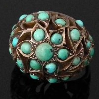 Lot 303 - 1920's fancy domed gold ring set with turquoise beads
