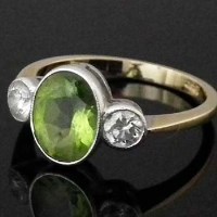 Lot 317 - 18ct gold dress ring set with an oval peridot
