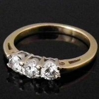 Lot 333 - 18ct gold three stone diamond ring.