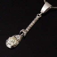 Lot 341 - White metal and yellow diamond pendant, with 9ct