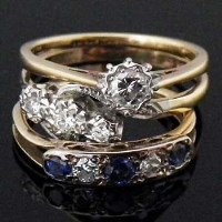 Lot 344 - Sapphire and diamond ring; three-stone diamond
