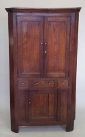 Lot 539 - George III oak floor standing corner cupboard