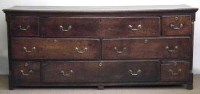 Lot 584 - George III oak enclosed dresser base
