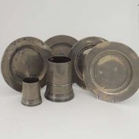 Lot 19 - Four pewter plates and two tankards.