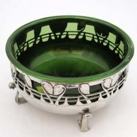 Lot 44 - Archibald Knox liberty bowl with green glass