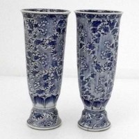 Lot 131 - Pair of 19th cent Kangxi style blue and white trumpet vases (restored)