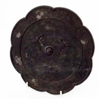 Lot 133 - Tang type floret shaped bronze mirror
