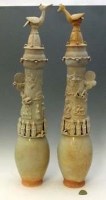 Lot 135 - Two slender yingqing funerary urns and covers