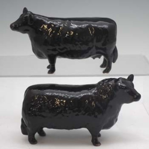 Lot 144 - Beswick Aberdeen Angus cow and bull.