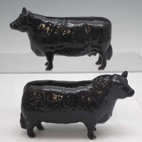 Lot 144 - Beswick Aberdeen Angus cow and bull.