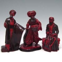 Lot 147 - Two Royal Doulton Flambe Carpet sellers and a lamp seller