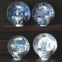 Lot 205 - Four 19th century blue transfer tea bowls and saucers.