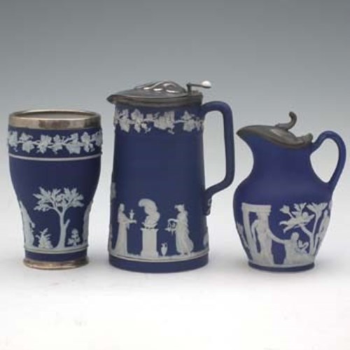 Lot 236 - Two Wedgwood ewers and a vase,   with plated and
