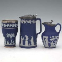 Lot 236 - Two Wedgwood ewers and a vase,   with plated and