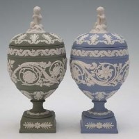 Lot 253 - Two Wedgwood jasper lidded vases  with cherub