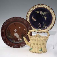 Lot 288 - Wedgwood terracotta plate, majolica plate and a teapot