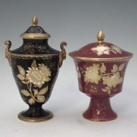 Lot 305 - Two Wedgwood Tonquin pattern lidded vases   one