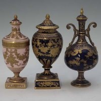Lot 309 - Two Wedgwood lidded vases and a similar Doulton vase