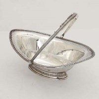 Lot 348 - Pierced silver basket with swing handle.
