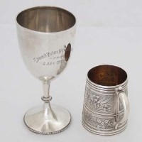 Lot 371 - Silver mug and a trophy.